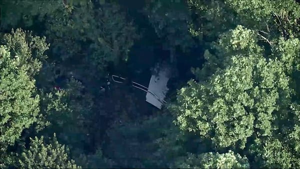 This image taken from video provided by WPVI-TV/6ABC shows a small skydiving aircraft that went off the end of a runway at Cross Keys Airport in Gloucester County, N.J., on Wednesday evening, July 2, 2025. (WPVI-TV/6ABC via AP)
