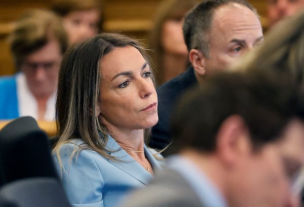 Karen Read listens to the testimony of Jennifer McCabe during her murder trial in Norfolk Superior Court in Dedham, Mass., Wednesday, April 30, 2025. (Greg Derr/The Patriot Ledger via AP, Pool)