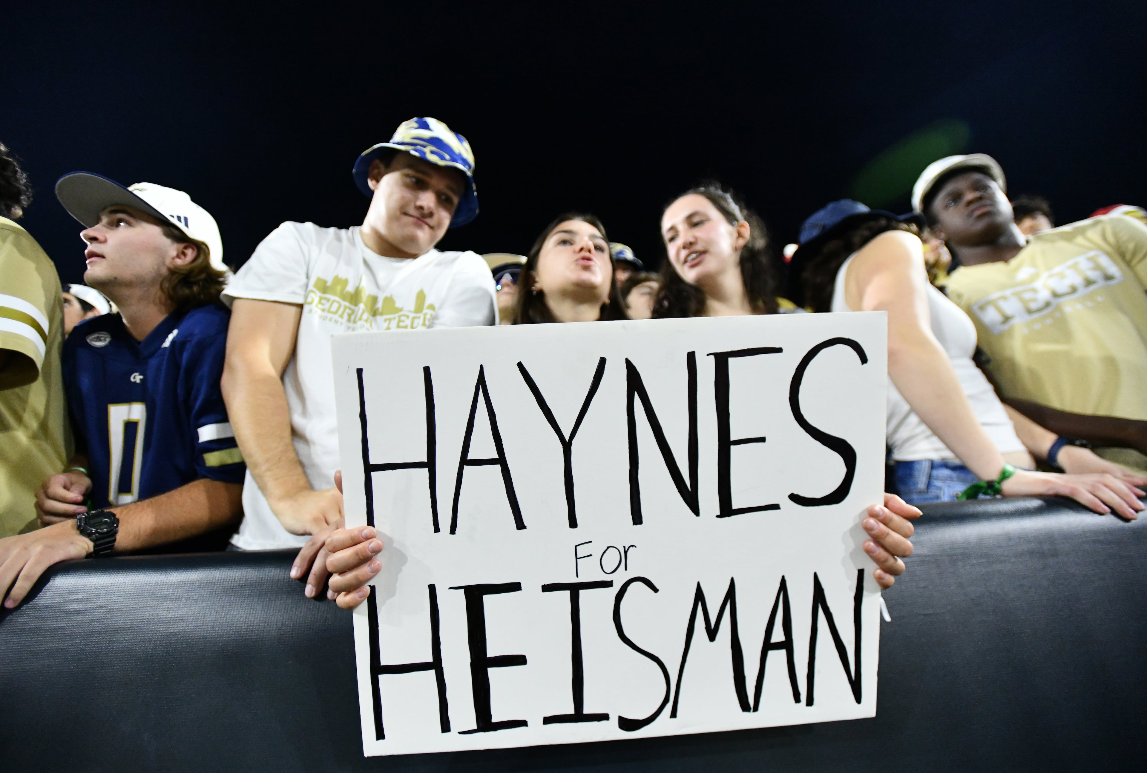 Georgia Tech holds a sign before the final regular-season home game against Pittsburgh at Bobby Dodd Stadium, Saturday, November 22, 2025 in Atlanta. (Hyosub Shin / AJC)