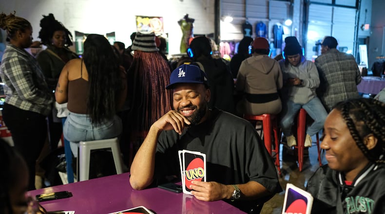 Controllerise attendees play Uno and other games.