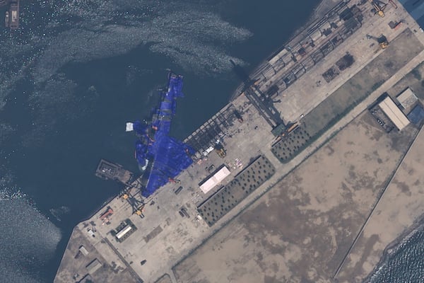 This satellite image provided by Airbus DS, shows a blue tarp covering a North Korean destroyer after it suffered a failed launch while it was being put to sea in Chongjin, North Korea, Thursday, May 22, 2025. (Airbus DS via AP)