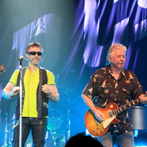 FILE - Howard Leese, from left, Paul Rodgers, and Mick Ralphs, of the classic rock band Bad Company, perform in Bethlehem, Pa., on July 29, 2013. (Photo by Owen Sweeney/Invision/AP, File)
