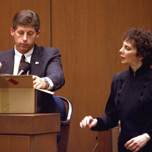 FILE - Los Angeles Police Detective Mark Fuhrman shows the jury in the O.J. Simpson double murder trial evidence during testimony Friday, March 10, 1995, in Los Angeles. (AP Photo/Nick Ut, Pool, File)