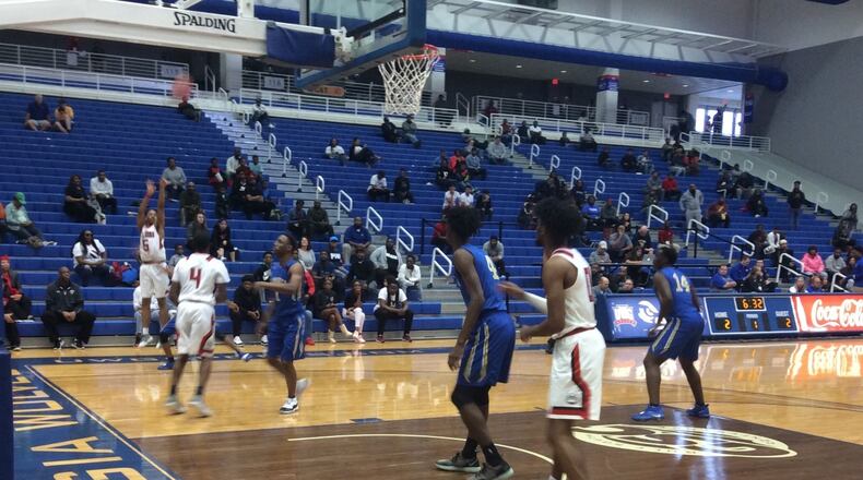 De'Marcus Johnson of Tri-Cities lets a 3-pointer fly in the first quarter of the Bulldogs' semifinal game Saturday against Brunswick at the University of West Georgia.