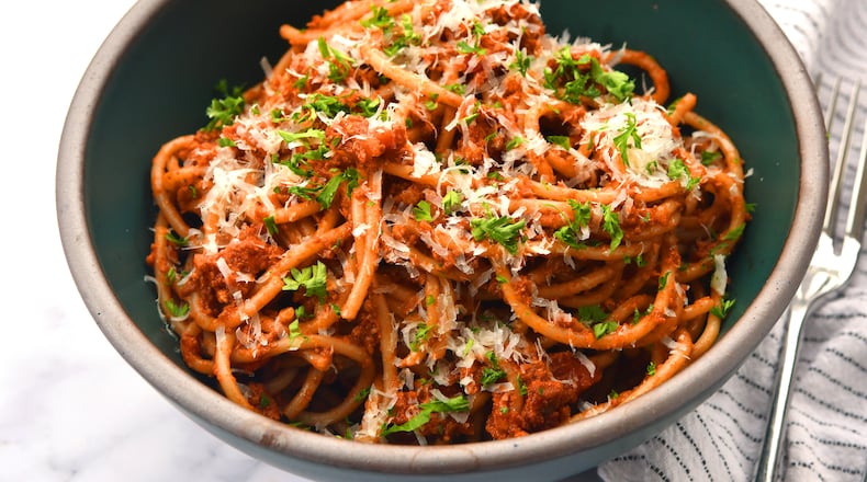 Spaghetti with Mushroom Ragu. This vegetarian dish can become vegan by simply omitting the Parmesan cheese and rind.
(CHRIS HUNT FOR THE ATLANTA JOURNAL-CONSTITUTION)