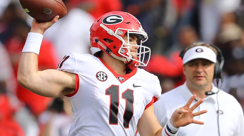 Georgia head coach Kirby Smart watches from the field while Jake Fromm throws during the annual G-Day spring game on Saturday, April 21, 2018, in Athens.