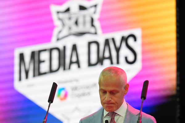 Big 12 Commissioner Brett Yormark pauses during a moment of silence for the victims of recent flooding in Texas before delivering a speech at the Big 12 NCAA college football media days in Frisco, Texas, Tuesday, July 8, 2025. (AP Photo/LM Otero)