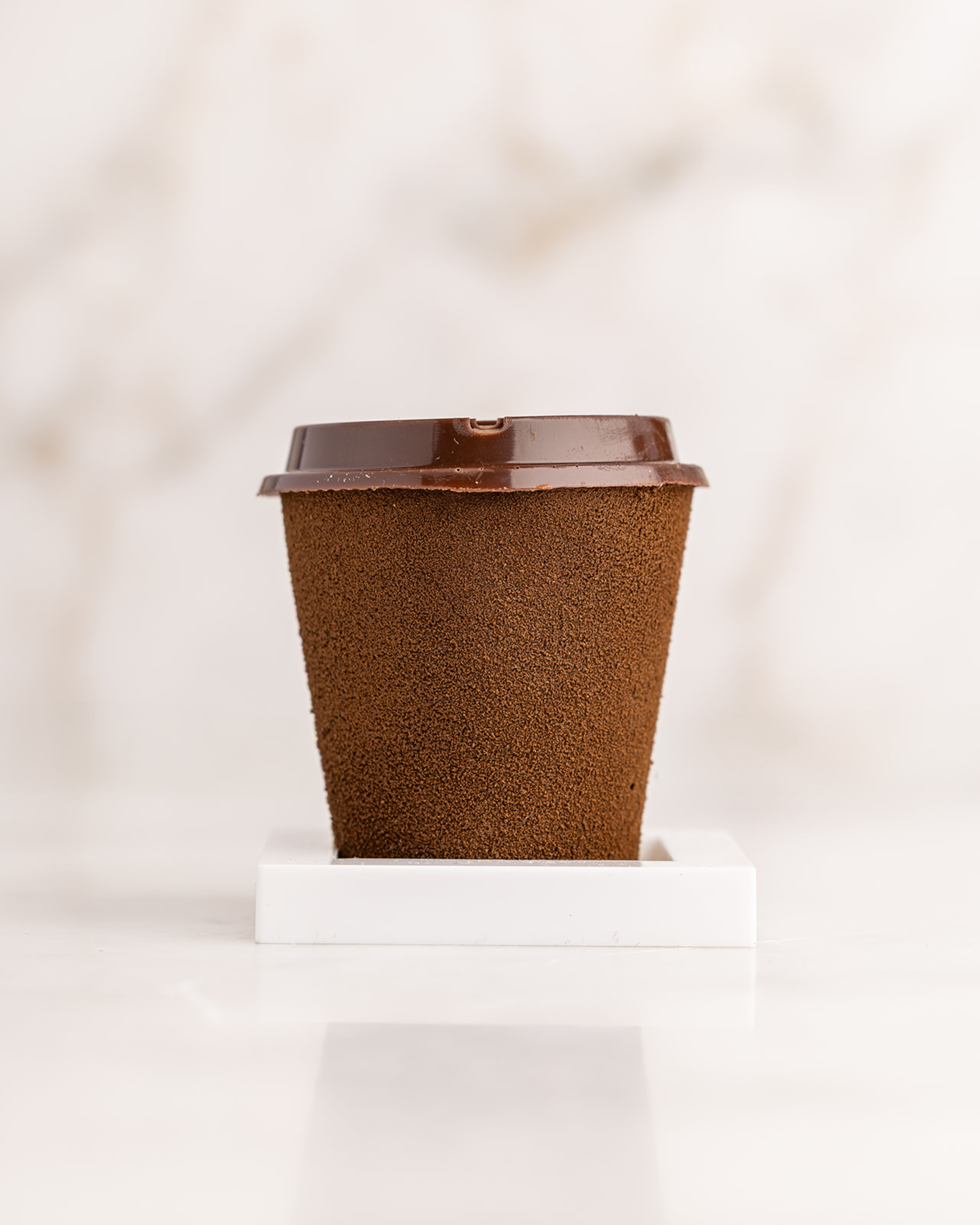 The caramel mocha latte dessert at Peckish looks like a realistic coffee cup. (Courtesy of Atlanta Creative Media)