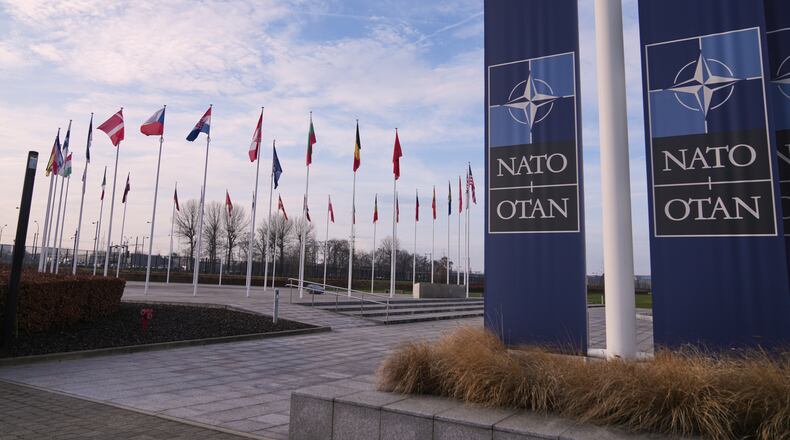FILE - Flags flap in the wind outside NATO headquarters in Brussels, Jan. 19, 2026. (AP Photo/Virginia Mayo, File)