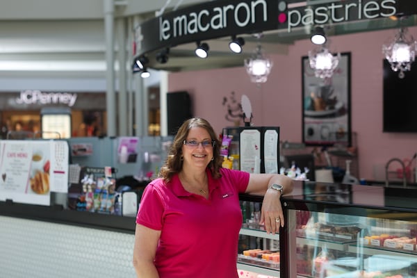 Le Macaron owner Lisa Amundsen at her pastry shop at North Point Mall in Alpharetta on April 10, 2026. (Arvin Temkar/AJC)