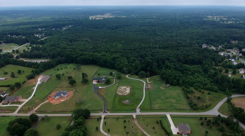 Aerial view of the 160 acres near June Ivey and Indian Shoals roads near Dacula proposed for a new subdivision development. HYOSUB SHIN / HSHIN@AJC.COM