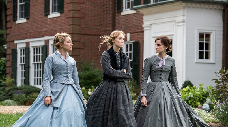 Florence Pugh (from left), Saoirse Ronan and Emma Watson play sisters Amy, Jo and Meg March in “Little Women.” Wilson Webb/Columbia Pictures