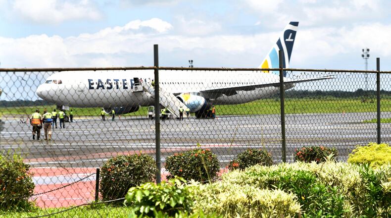 A plane carrying the deportees from the United States arrives at the Roberts International Airport outside of Monrovia, Liberia, Thursday, Aug. 20, 2026. (AP Photo/Alexander Wiaplah)