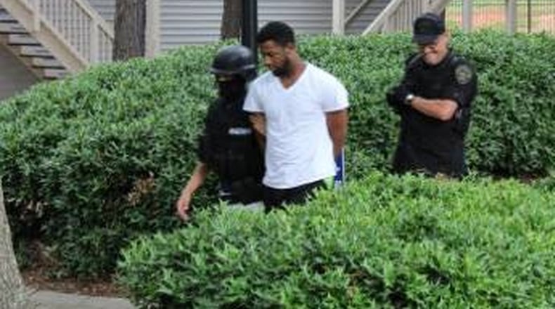 Malcolm Jamal Brown, alleged Bloods gang leader, is arrested in connection with the 2014 murders of two women.