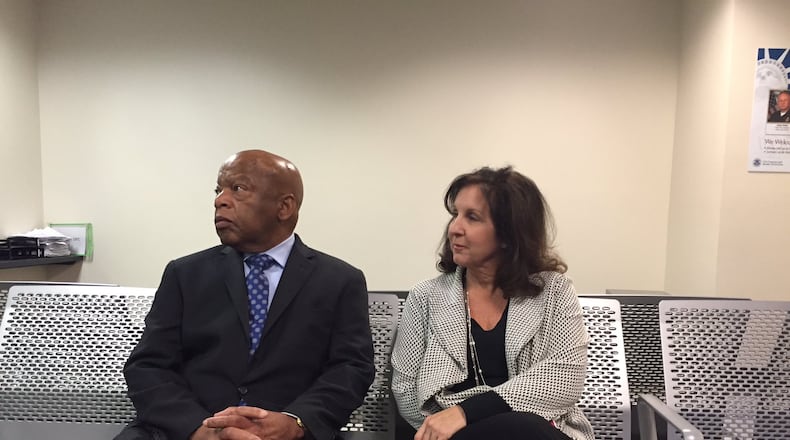 At first, a U.S. Customs and Border Protection official would not say how many people were being detained at Hartsfield-Jackson Atlanta International Airport Saturday following President Donald Trump’s executive order, U.S. Rep. John Lewis said. So Lewis turned to a gathering crowd of activists and attorneys at the airport and declared: “Why don’t we just sit down and stay a while.” JEREMY REDMON/jredmon@ajc.com