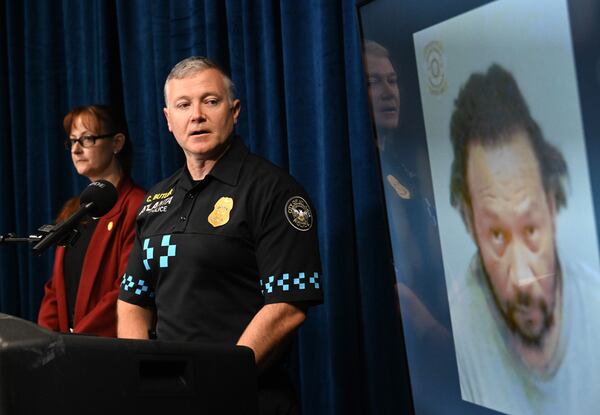 Lt. Christapher Butler and detective Summer Benton discuss details of the 1999 cold case after arresting and charging Janarra Sherrer with murder. (Hyosub Shin/AJC)