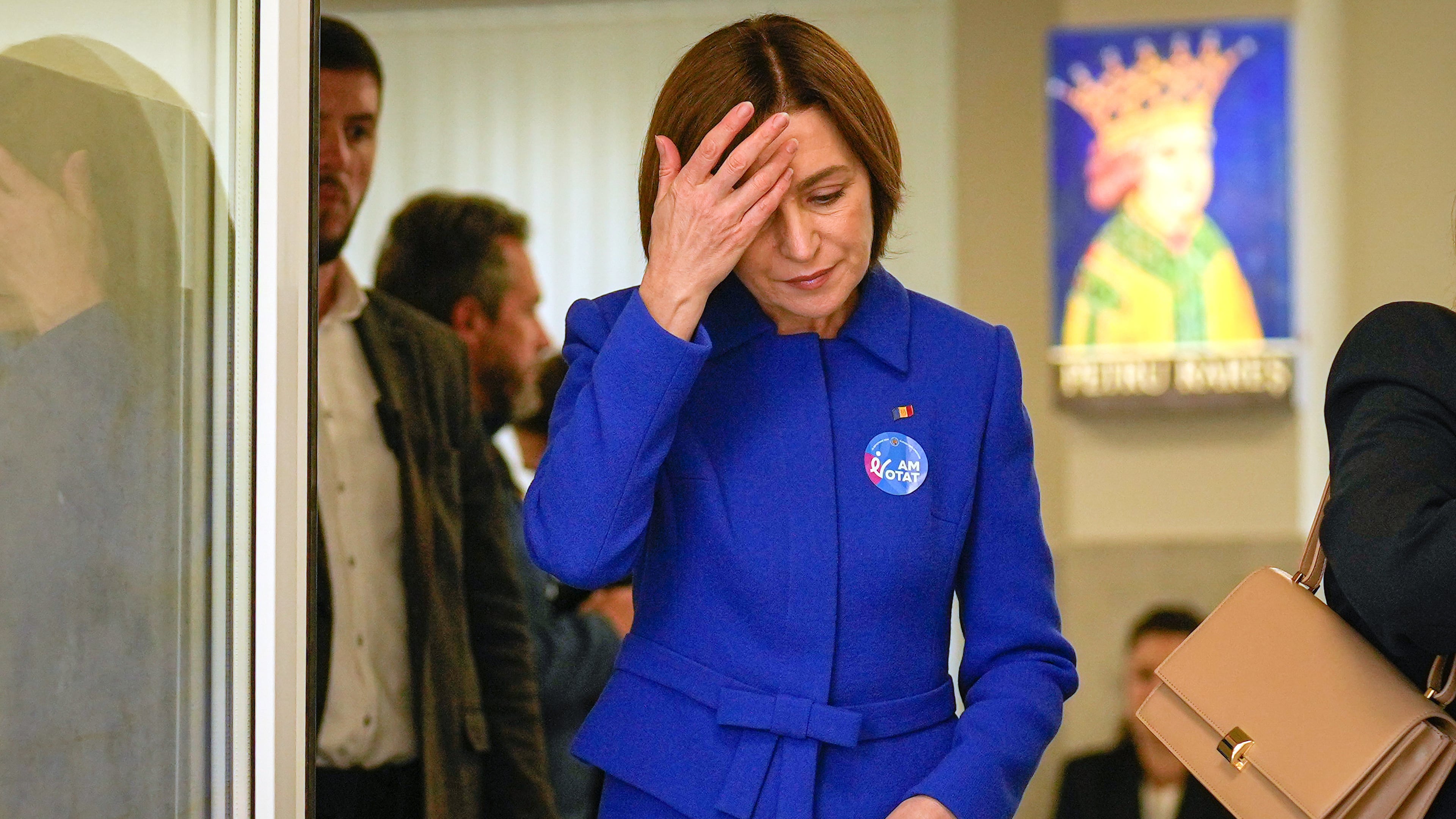 Moldova's President Maia Sandu exits a voting station after casting her vote during a parliamentary election, in Chisinau, Moldova, Sunday, Sept. 28, 2025. (AP Photo/Vadim Ghirda)