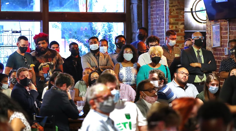 A crowd fills a room at Manuel's Tavern room to hear mayoral candidates at a forum hosted by The Young Democrats of Atlanta on Aug. 4. (Curtis Compton / Curtis.Compton@ajc.com)