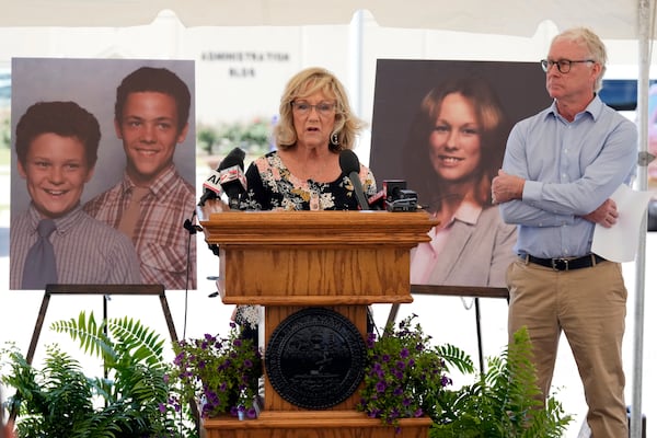 Terri Osborne, center, speaks as her brother, Mike Robirds, right, listens outside Riverbend Maximum Security Institution after the execution of Oscar Smith Thursday, May 22, 2025, in Nashville, Tenn. Osborne and Robirds are siblings of Judy Robirds, shown in the photograph at right, who was murdered, along with her sons, shown in the photograph at left, by Oscar Smith in 1989. (AP Photo/Mark Humphrey)