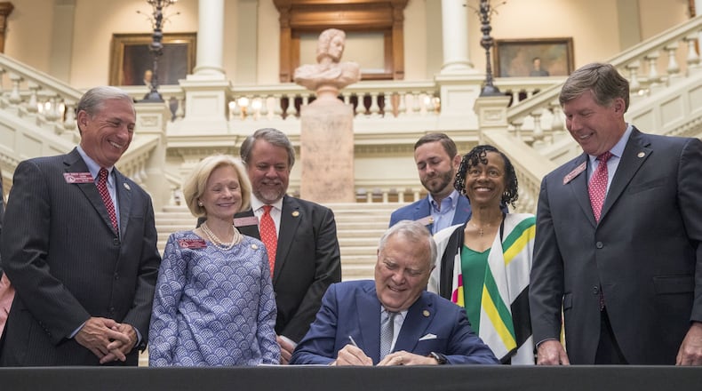 Georgia Governor Nathan Deal signs the 2019 fiscal year state budget at the Georgia State Capitol building in Atlanta, Wednesday. ALYSSA POINTER/ALYSSA.POINTER@AJC.COM