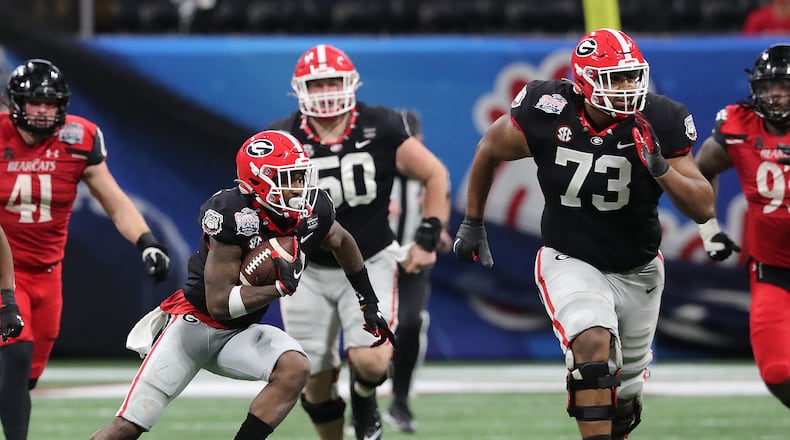 Georgia offensive lineman Xavier Truss looks to block for wide receiver Kearis Jackson against Cincinnati in the Peach Bowl on Friday, Jan. 1, 2021, in Atlanta. Curtis Compton / Curtis.Compton@ajc.com”