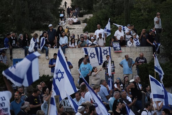Israelis attend a rally supporting Prime Minister Benjamin Netanyahu, outside the Knesset, Israel's parliament in Jerusalem, Thursday, June 5, 2025. (AP Photo/Mahmoud Illean)