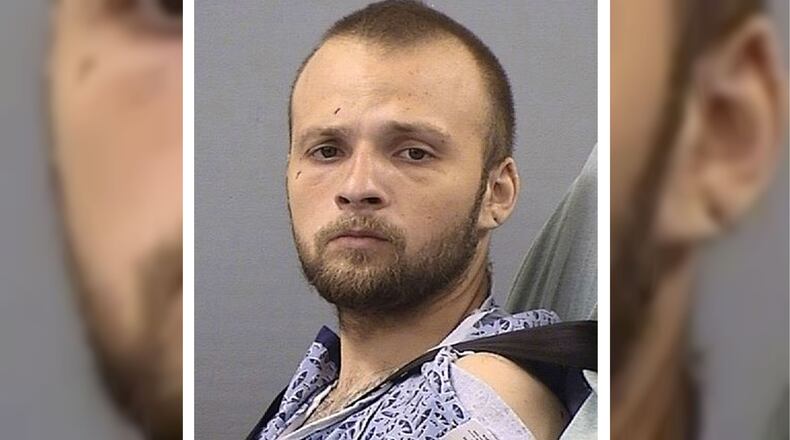 Michael Lee Cummins, 25, of Westmoreland, Tennessee, is pictured Friday, May 10, 2019, as he is booked into the Sumner County Jail following a couple of weeks in the hospital, where he was recovering after being shot by police. Cummins is accused of killing six people found beaten to death in their home Saturday, April 27, 2019, including his parents, uncle and a 12-year-old girl. Cummins is also charged in the death of a seventh person found beaten to death in her home that same day, as well as that of a man whose headless body was found near his cabin just outside Westmoreland April 17, 2019.