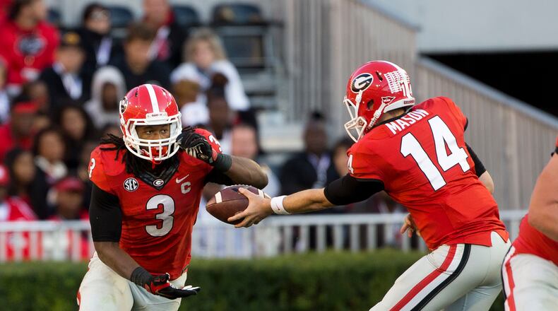 Georgia quarterback Hutson Mason (14) hands off to Georgia running back Todd Gurley (3) in the second half of an NCAA college football game against Vanderbilt Saturday, Oct. 4, 2014, in Athens, Ga.. Georgia won 44-17. (AP Photo/John Bazemore) Hutson Mason may not have Todd Gurley to hand ball to for rest of season. (AP)