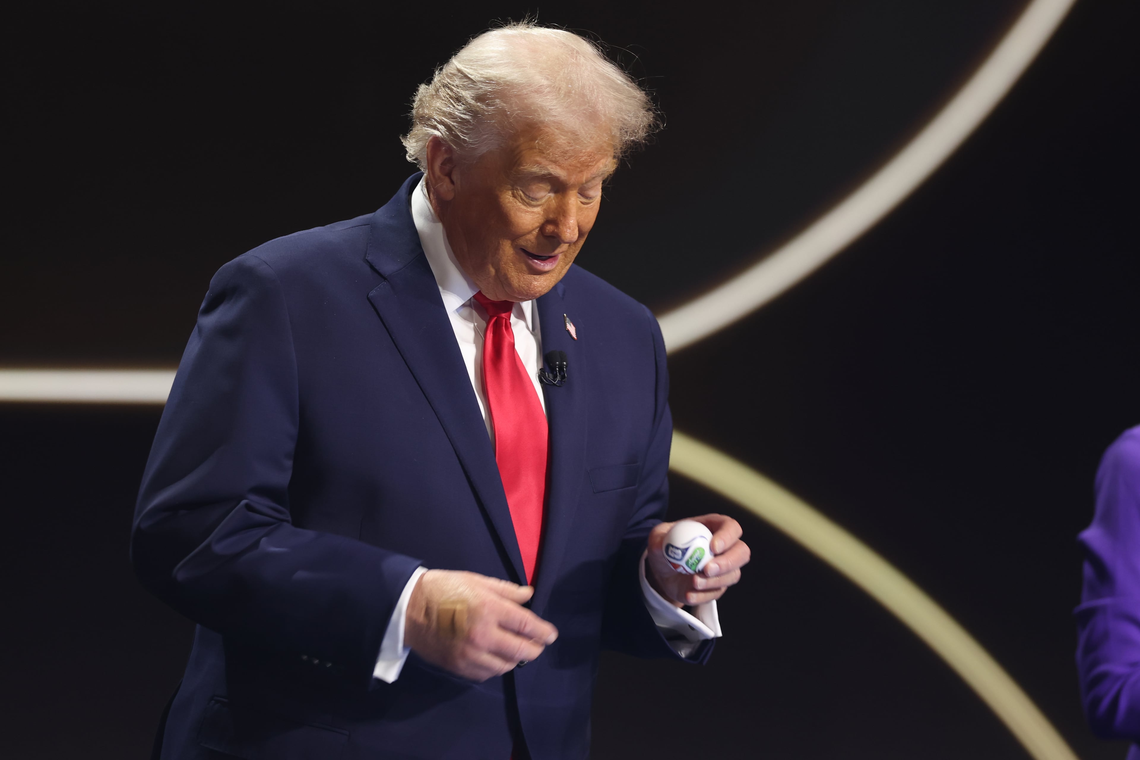 President Donald Trump smiles during the draw for the 2026 soccer World Cup at the Kennedy Center in Washington, Friday, Dec. 5, 2025. (Dan Mullan/Pool Photo via AP)