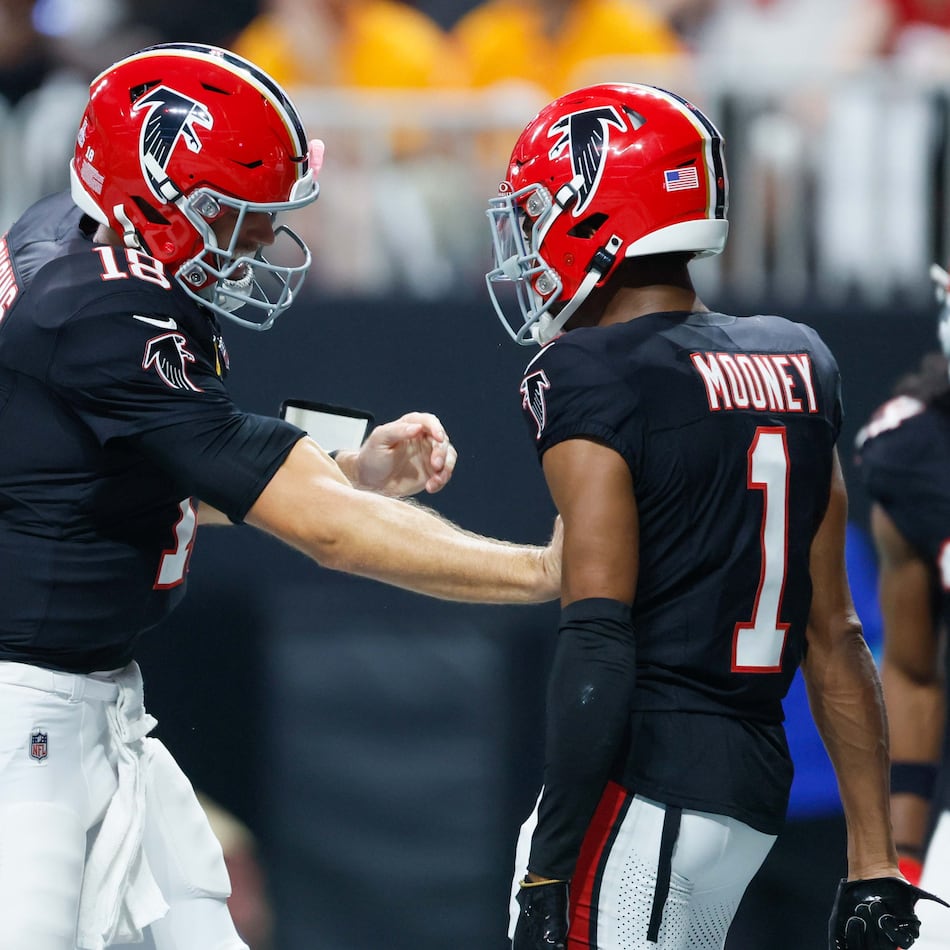 Atlanta Falcons wide receiver Darnell Mooney (1) celebrates with quarterback Kirk Cousins (18) after his touchdown during the first half of a game last year against the Tampa Bay Buccaneers at Mercedes-Benz Stadium in Atlanta.
(Miguel Martinez/ AJC)