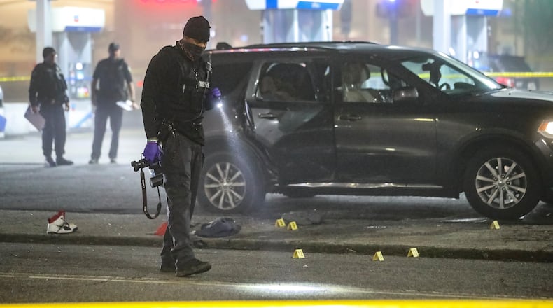 A man was rushed to a hospital in critical condition during the very early hours of Feb. 11, 2021, after he was shot outside a gas station in southwest Atlanta. He was one of two men shot inside an SUV at a Chevron on the corner of Martin Luther King Jr. Drive and Peyton Road, according to Atlanta police. (JOHN SPINK / John.Spink@ajc.com)