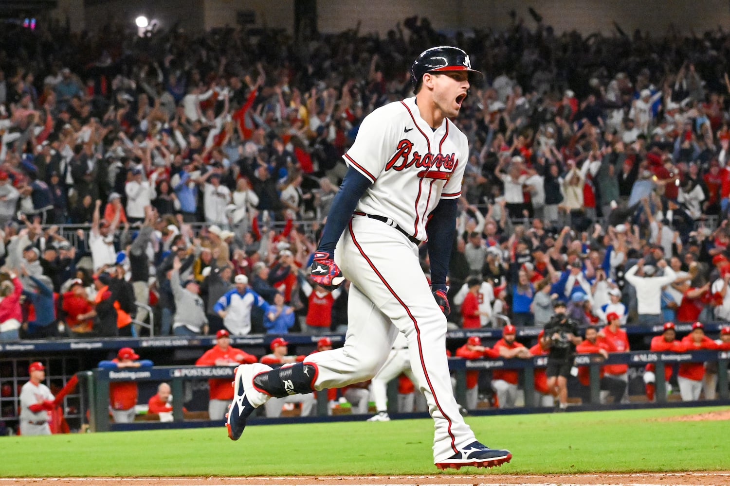 Atlanta Braves’ Austin Riley (27) celebrates a two-run home run against the Philadelphia Phillies during the eighth inning of NLDS Game 2 in Atlanta on Monday, Oct. 9, 2023.   (Hyosub Shin / Hyosub.Shin@ajc.com)