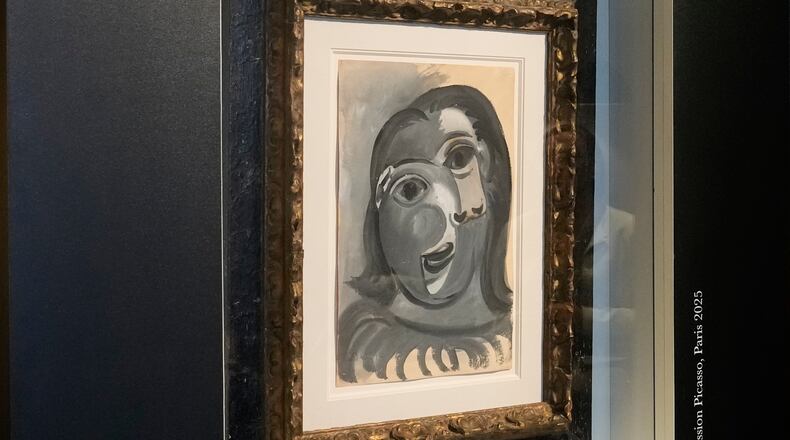 The Head of a Woman by Pablo Picasso, painted in 1941, is presented in Paris, Friday, April 10, 2026, ahead of a lottery in which the painting is being raffled off to raise money for Alzheimer’s research. (AP Photo/Michel Euler)