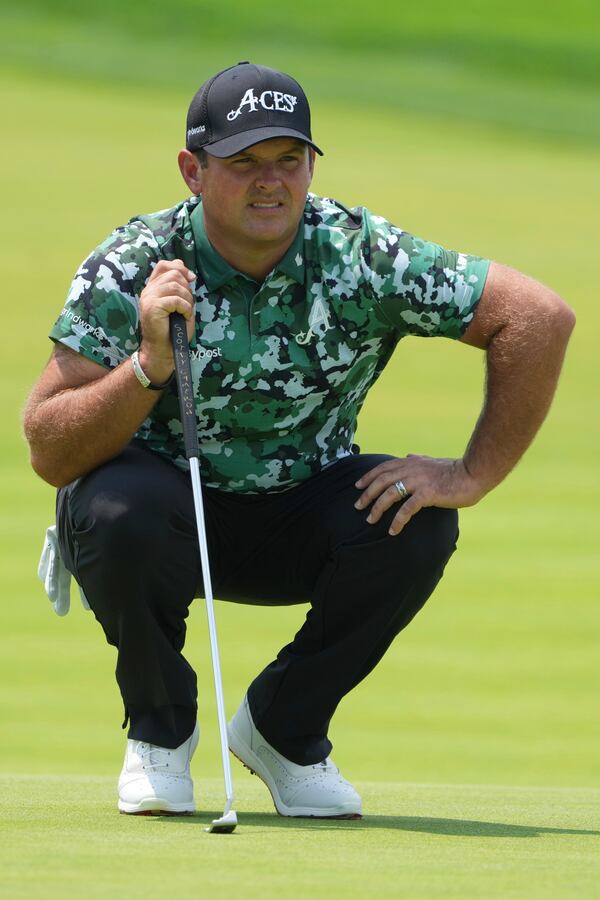 Patrick Reed lines up a putt on the first hole during the first round of the U.S. Open golf tournament at Oakmont Country Club Thursday, June 12, 2025, in Oakmont, Pa. (AP Photo/Gene J. Puskar)