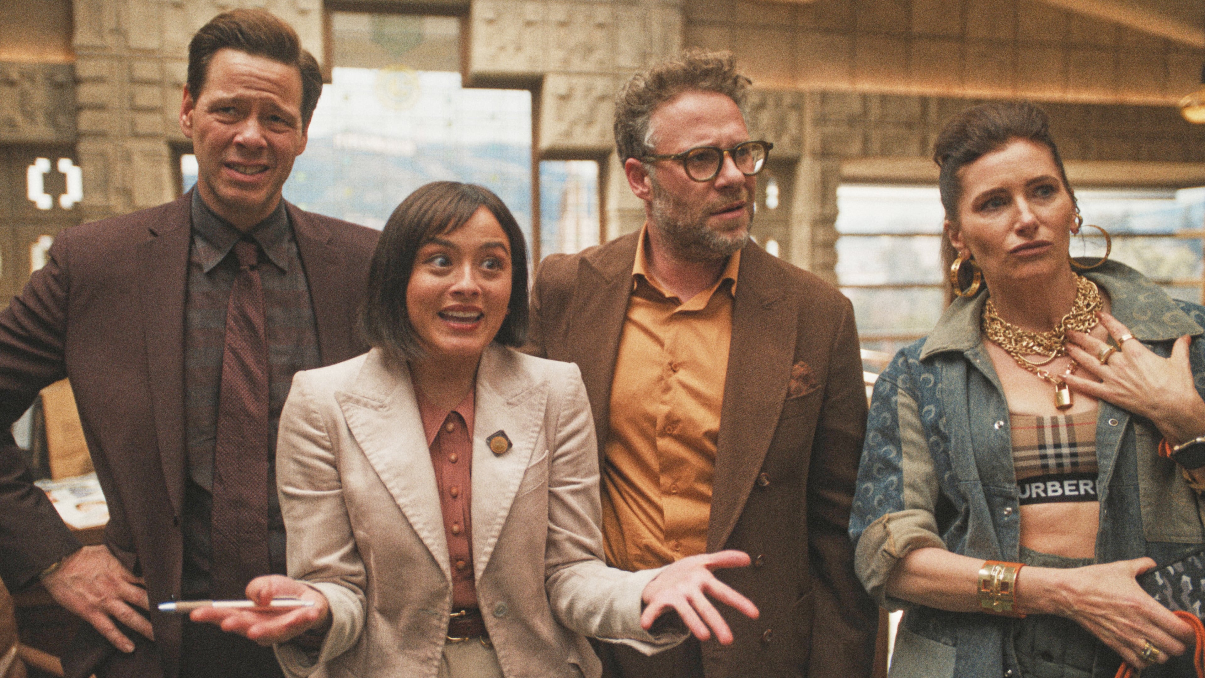This image released by Apple TV shows Ike Barinholtz, from left, Chase Sui Wonders, Seth Rogen and Kathryn Hahn in a scene from "The Studio." (Apple TV via AP)