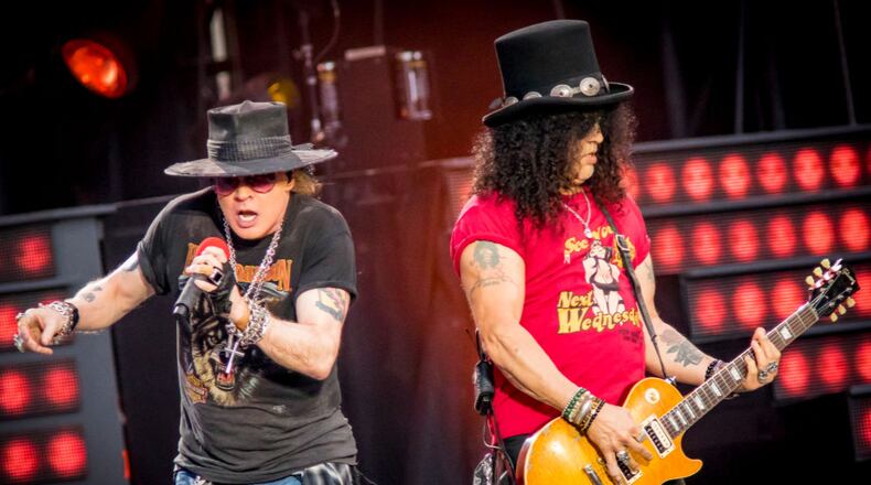Axl Rose  (left) and Slash of Guns N' Roses perform onstage during the 'Not In This Lifetime' Tour.