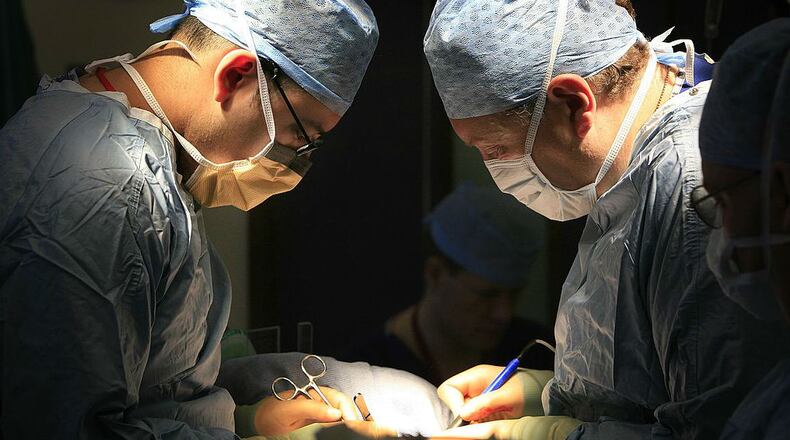 Doctors perform a kidney transplant at the Queen Elizabeth Hospital Birmingham in Birmingham, England, in a 2006 file photo.