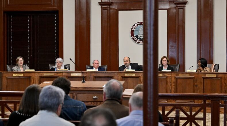 Georgia State Election Board members, from left, Sara Tindall Ghazal, Salleigh Grubbs, Executive Director James Mills, Chair John Fervier, Vice Chair Janice Johnston and Janelle King discuss agendas during the State Election Board’s monthly meeting at the Historic Barrow County Courthouse, Wednesday, Jan. 21, 2026, in Winder. (Hyosub Shin/AJC)