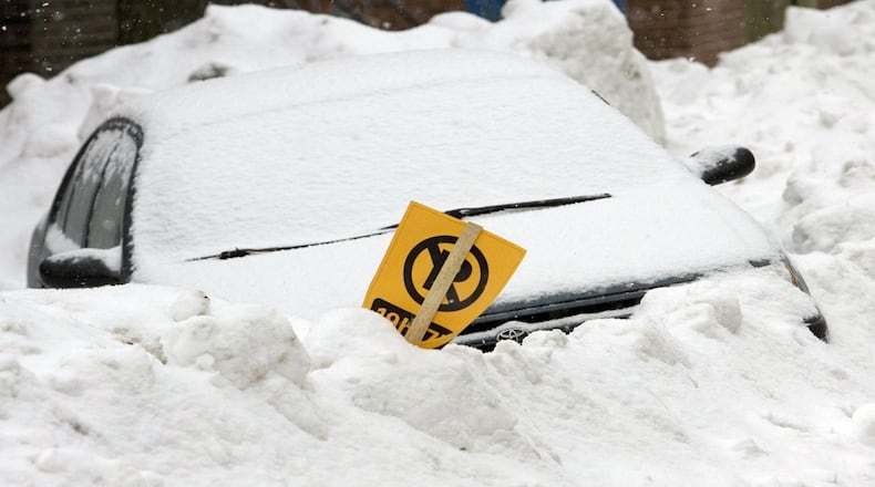 File photo of a car seen buried in snow in Montreal, Canada, on March 15, 2008.