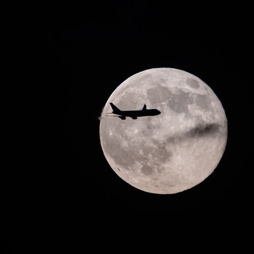 A UPS Boeing 747 inbound from Anchorage, Alaska, passes in front of the supermoon as it approaches Louisville Muhammad Ali International Airport on Wednesday, Nov. 5, 2025, in Louisville, Ky. (AP Photo/Jon Cherry)