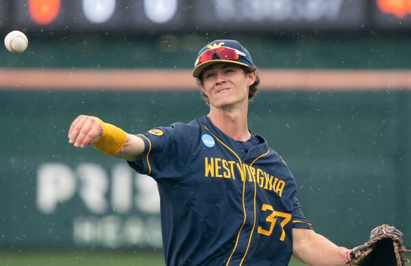 FILE - West Virginia infielder Ben Lumsden warms up before an NCAA regional college baseball game against Kentucky, May 30, 2025, in Clemson, S.C. (AP Photo/Sean Rayford, File)