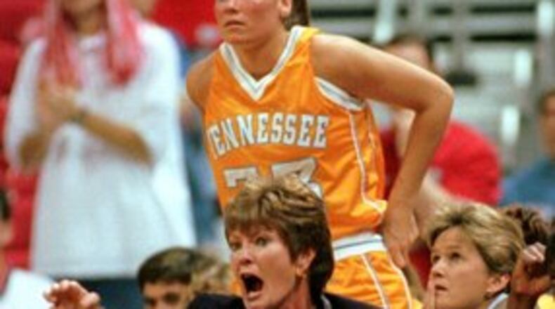 Summitt directs her team from the sidelines during the first half against Wisconsin, Sunday, Dec. 12, 1999. Behind is Kristen Clement (33). Summitt is trying for her 700th win.