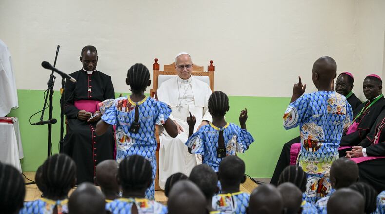 Pope Leo XIV watches children perform a dance as he visits the Ngul Zamba (Power of God) orphanage in Yaounde, Cameroon, Wednesday April 15, 2026 on the third day of his apostolic journey to Africa. (Alberto Pizzoli, Pool Photo via AP)