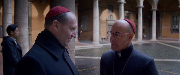 This image released by Focus Features shows Ralph Fiennes, left, and Stanley Tucci in a scene from "Conclave." (Focus Features via AP)