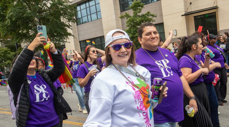 Katie Rinderle, the Cobb County teacher who was fired for reading a book that challenges gender norms to her students, marches with the law firm that represents her in the annual Pride Parade on Sunday, Oct 15, 2023. Rinderle is appealing her termination. (Jenni Girtman for The Atlanta Journal-Constitution)
