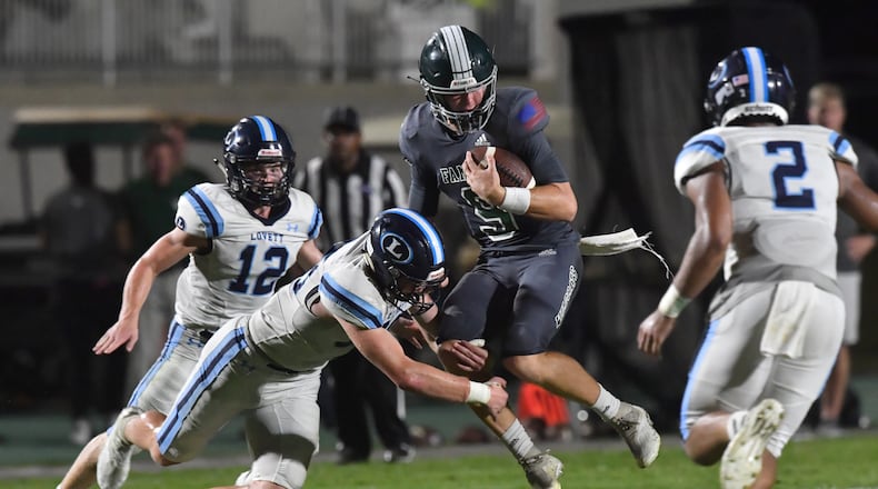 August 20, 2021 Atlanta - Westminster's QB John Collier (9) gets tackled by Lovett's Garrett Kelly (88) in the second half of their season opener game at The Westminster Schools in Atlanta on Friday, August 20, 2021. Westminster won 17-7 over Lovett. (Hyosub Shin / Hyosub.Shin@ajc.com)