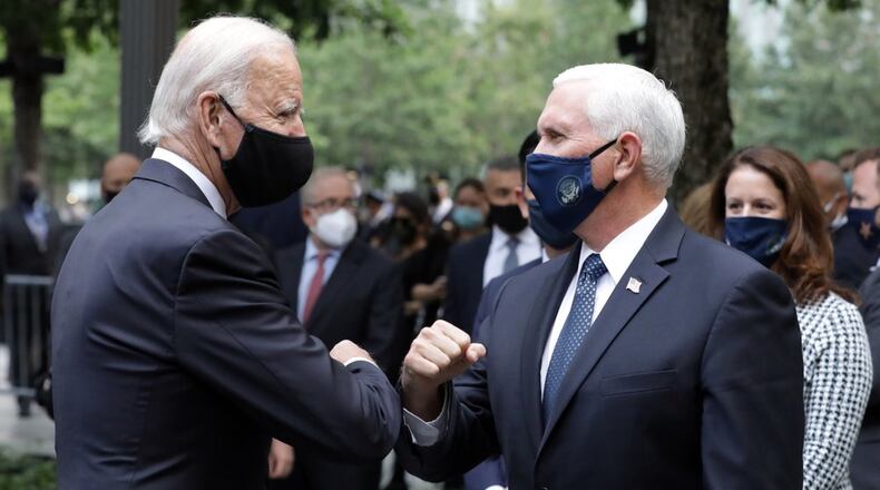 Democratic presidential candidate former Vice President Joe Biden greets Vice President Mike Pence at the 19th anniversary ceremony in observance of the Sept. 11 terrorist attacks at the National September 11 Memorial & Museum in New York, on Friday. (Amr Alfiky/The New York Times via AP, Pool)