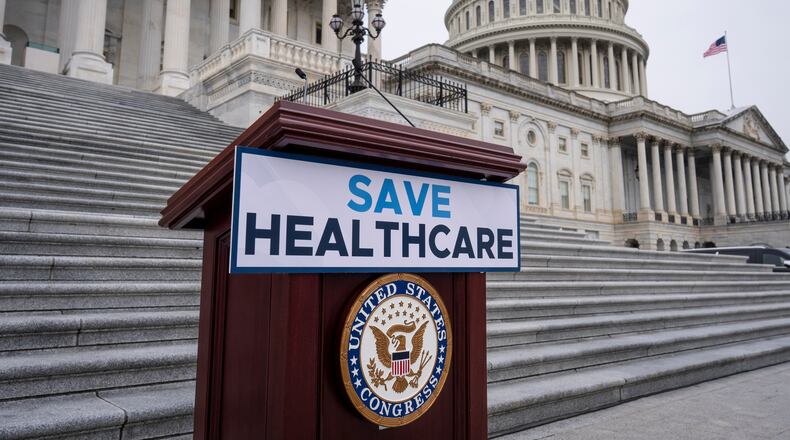FILE - House Democrats prepare to speak on the steps of the Capitol to insist that Republicans include an extension of expiring health care benefits as part of a government funding compromise, in Washington, Sept. 30, 2025. (AP Photo/J. Scott Applewhite, File)