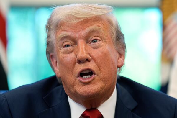 President Donald Trump speaks with reporters after signing executive orders in the Oval Office of the White House, Wednesday, April 23, 2025, in Washington. (AP Photo/Alex Brandon)