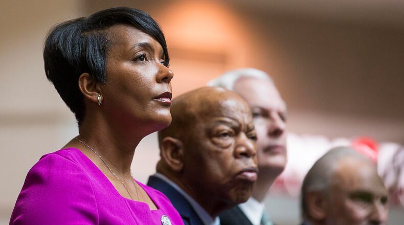 04/08/2019 — Atlanta, Georgia — Atlanta Mayor Keisha Lance Bottoms (left) sits with U.S. Congressman John Lewis (second from left) during a tribute to Congressman John Lewis in the atrium of the domestic terminal at Atlanta’s Hartsfield Jackson International Airport, Monday, April 8, 2019. The art exhibit “John Lewis-Good Trouble” was unveiled Monday with historical artifacts, audio and visual installations and tributes to the congressman. (ALYSSA POINTER/ALYSSA.POINTER@AJC.COM)